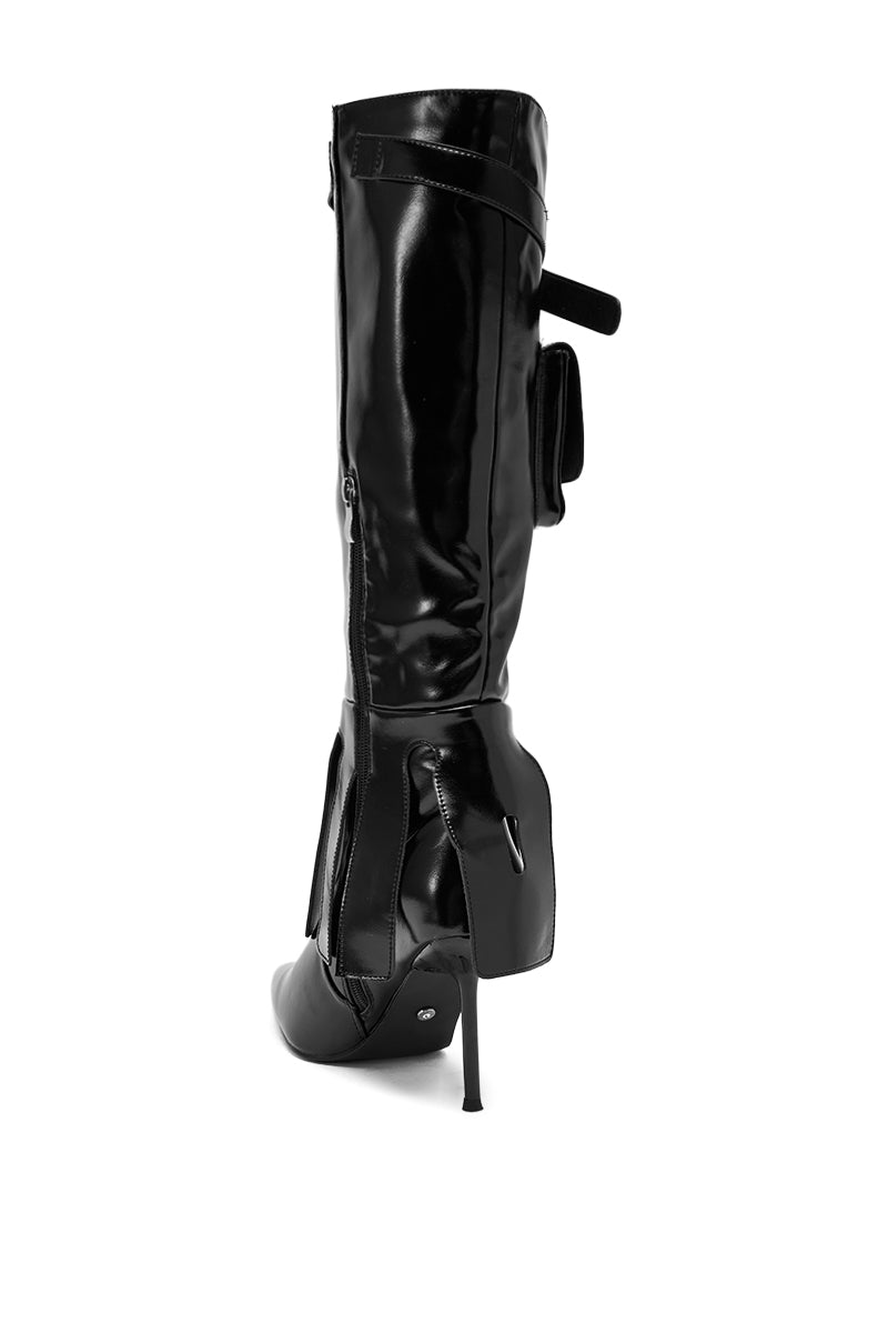The AZALEA WANG WATERS BLACK STILETTO BOOT WITH POCKETS is a shiny faux leather knee-high boot with a pointed toe, high stiletto heel, convenient side zipper, and a small pocket near the top.