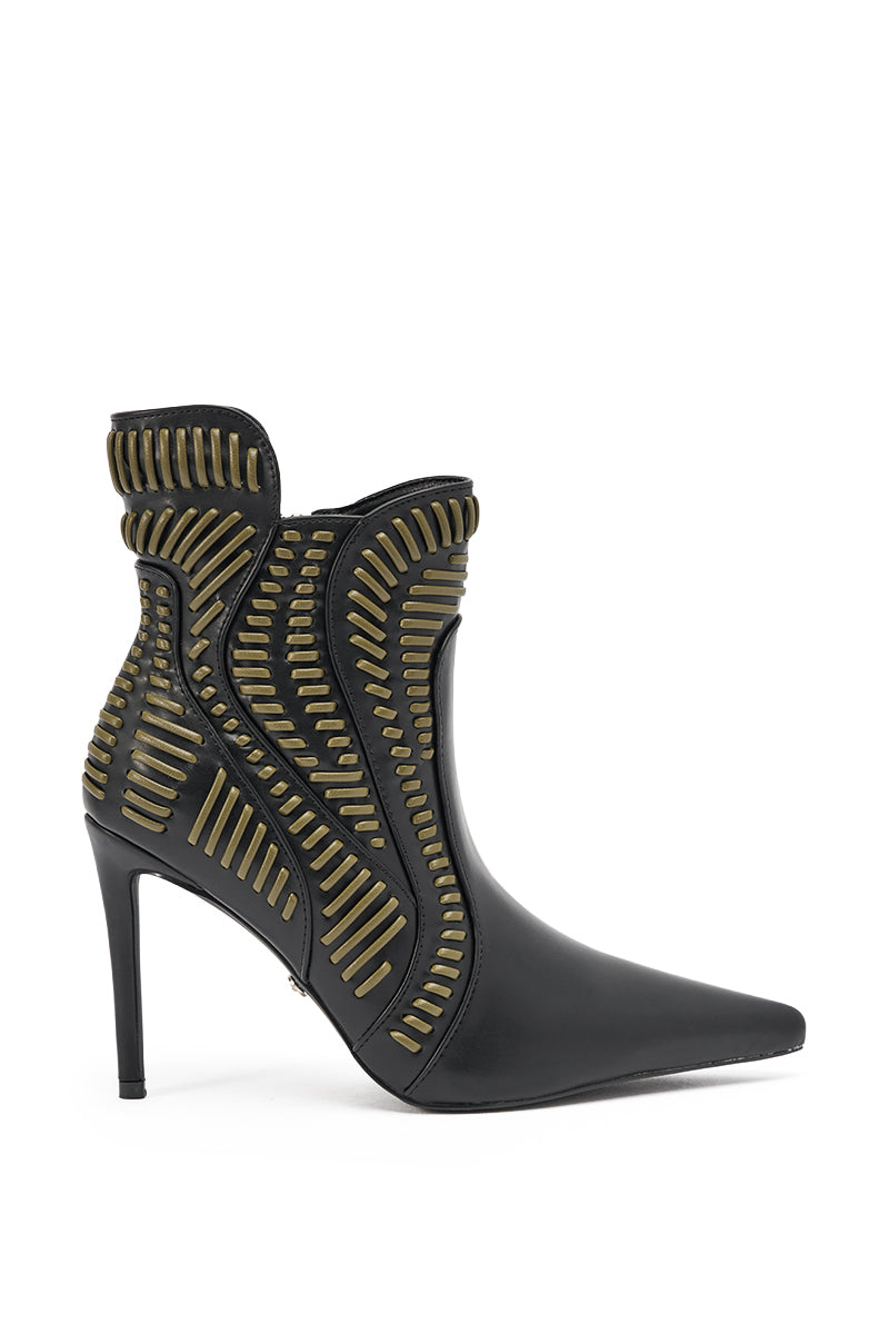 The AKIRA GOLD WEAVER BLACK AND OLIVE BOOTIE is a black faux leather bootie with a pointed toe and decorative olive green textured accents in curved, geometric patterns along the sides and ankle. 3