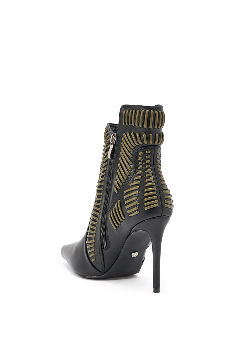 The AKIRA GOLD WEAVER BLACK AND OLIVE BOOTIE features a high stiletto heel, pointed toe, gold horizontal embellishments, side zipper, and textured black faux leather design that extends from the heel to the ankle. 4