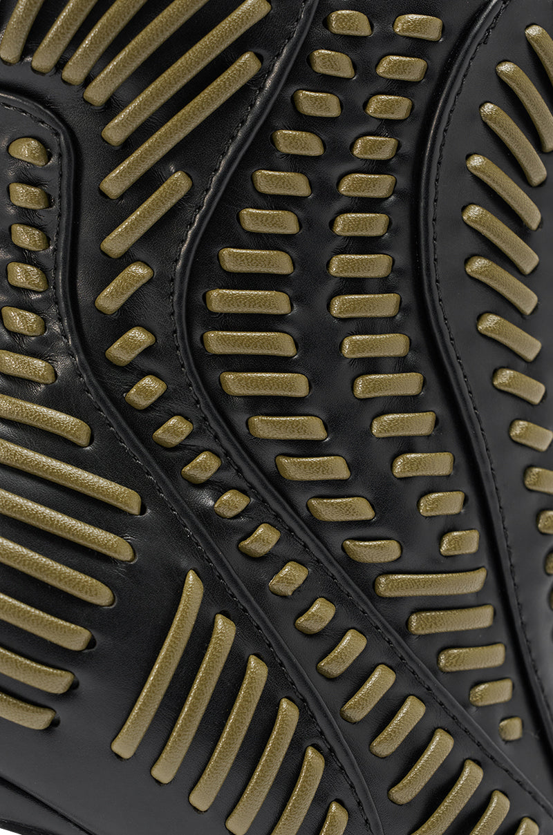 Close-up of the AKIRA GOLD WEAVER BLACK AND OLIVE BOOTIE in black faux leather, featuring rows of raised olive-green textured lines in a symmetrical wavy pattern. 6