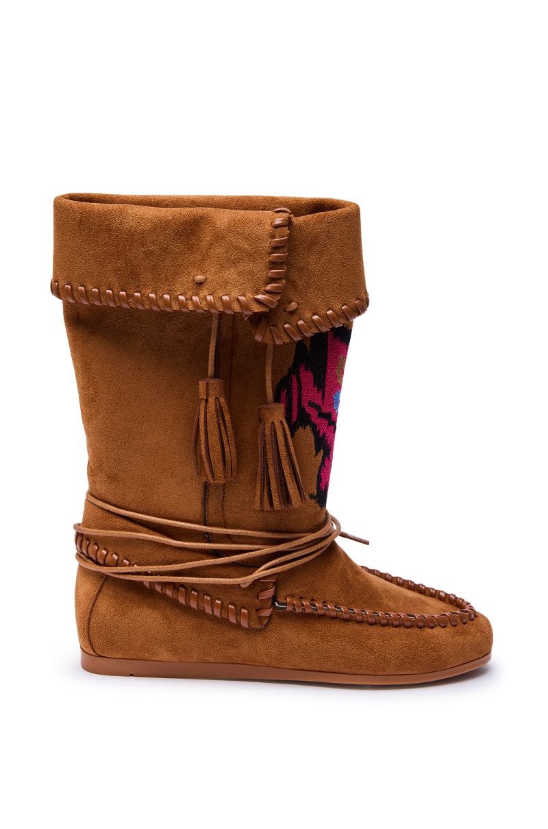 The AZALEA WANG WERET CHESTNUT FLAT BOOTIE features brown faux suede, a folded top, decorative stitching, tassels, wraparound laces, and a colorful pink and black woven pattern for chic boho flair.
