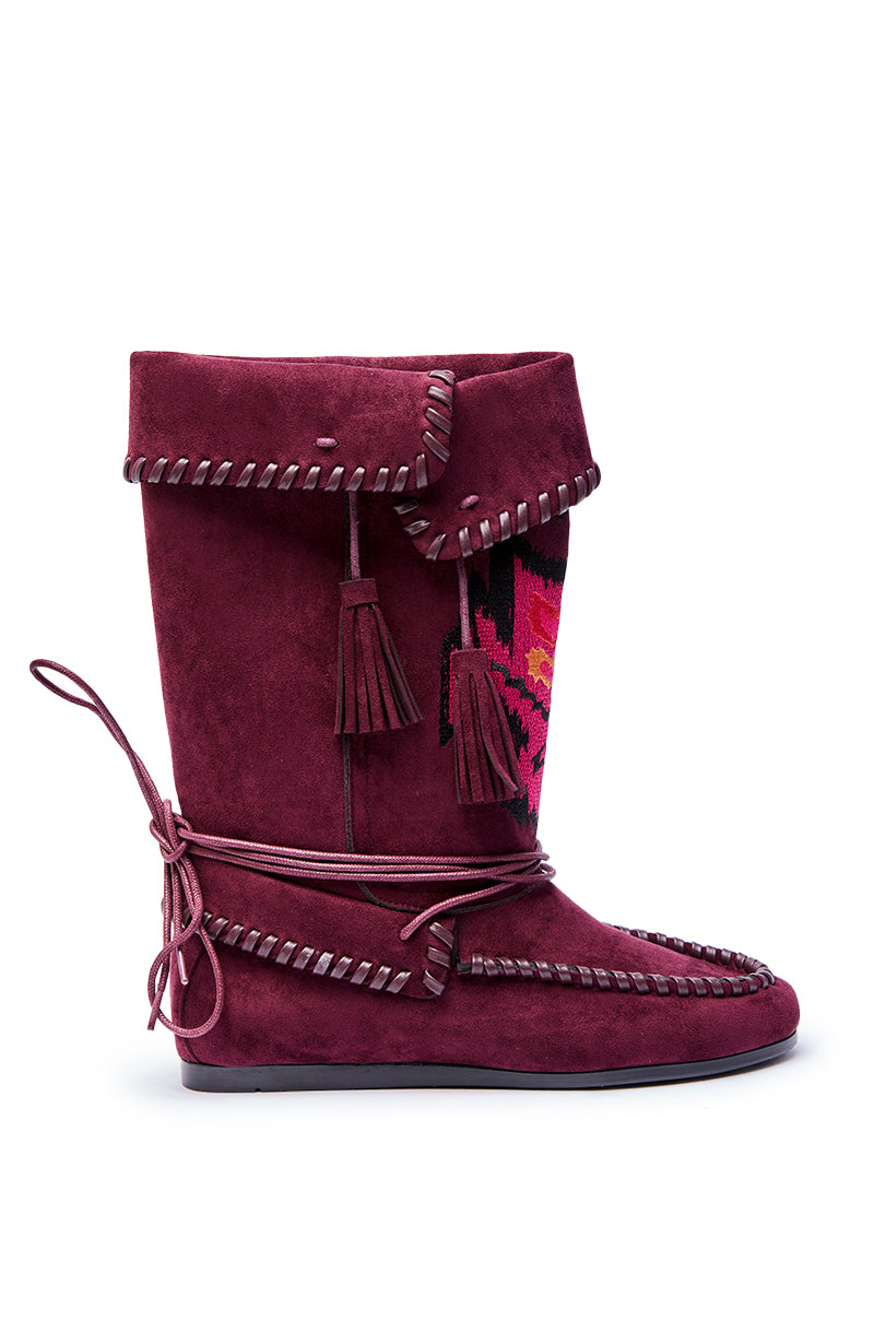 The AZALEA WANG WERET PLUM FLAT BOOTIE features burgundy faux suede, a fold-over top, side patterned panel, decorative stitching, tassels, wraparound laces, and a flat sole for stylish comfort.