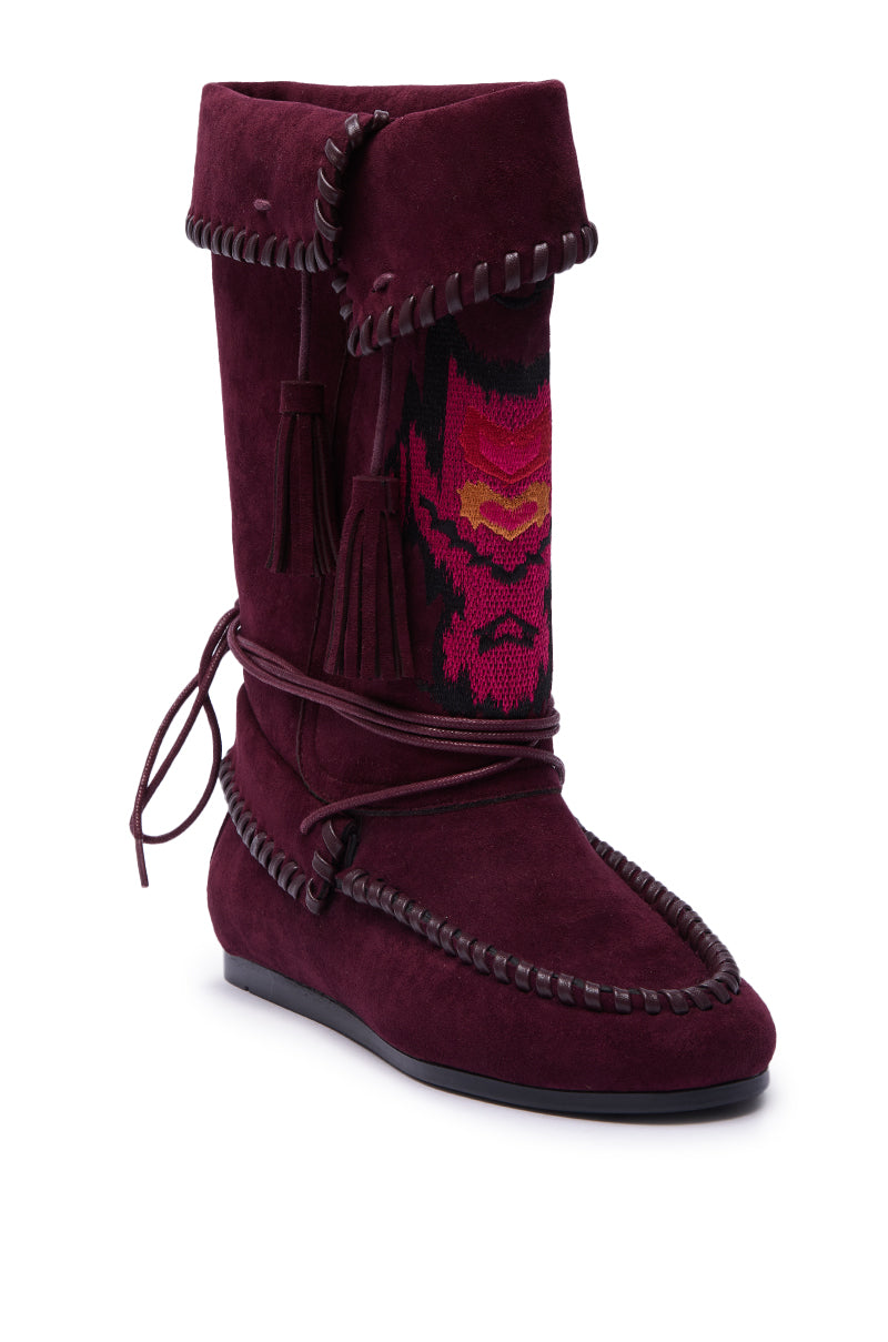 The AZALEA WANG WERET PLUM FLAT BOOTIE features burgundy suede, decorative stitching, tassels, wraparound laces, and a woven pink-orange front pattern. A flat dark sole adds comfort to this vibrant, bohemian style. 4