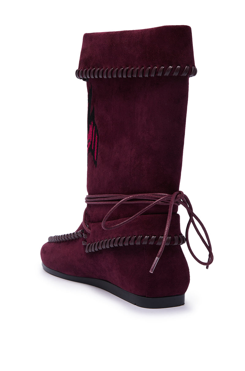The AZALEA WANG WERET PLUM FLAT BOOTIE features faux suede, black whipstitch accents, a flat sole, side embroidery, and wraparound laces tied at the back for a bohemian vibe. 5
