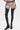 Wearing the AZALEA WANG WESTLANN BLACK PU CHAP BOOT, beige leopard print shorts, and a black belt, a person stands against a white background with only their lower body visible.