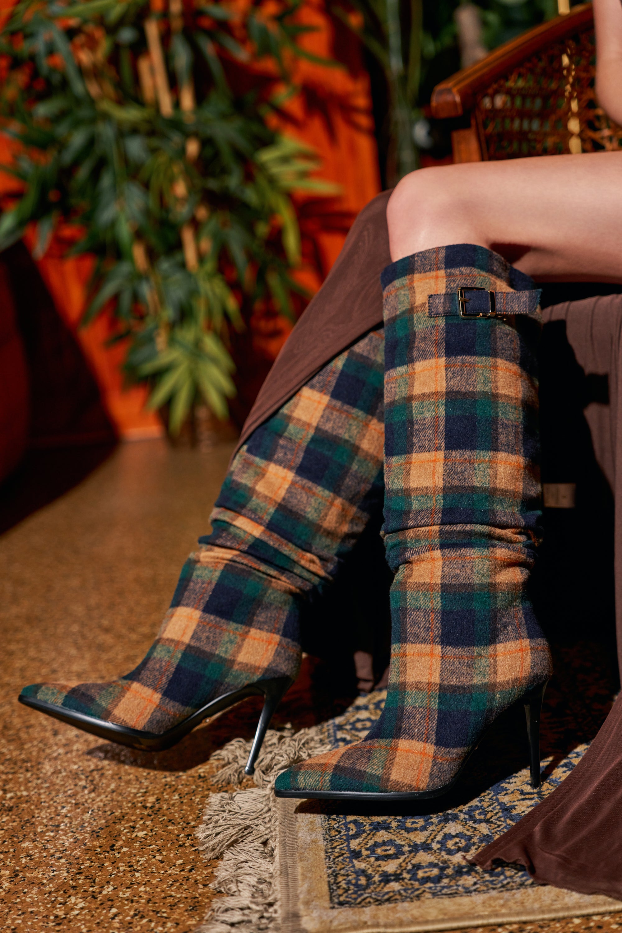 AZALEA WANG WISHBONE PLAID PRINT STILETTO BOOT in green, orange, and navy, featuring a knee-high knit design and a buckled strap at the top.