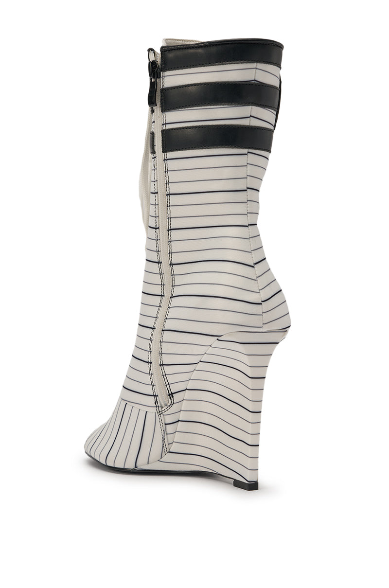 The AZALEA WANG WYATT WHITE STRIPED NAUTICAL OPEN TOE BOOTIE is a modern white minimalist bootie with a wedge heel, thin black horizontal stripes, side zipper, two black bands near the top, and a mid-calf shaft. 5