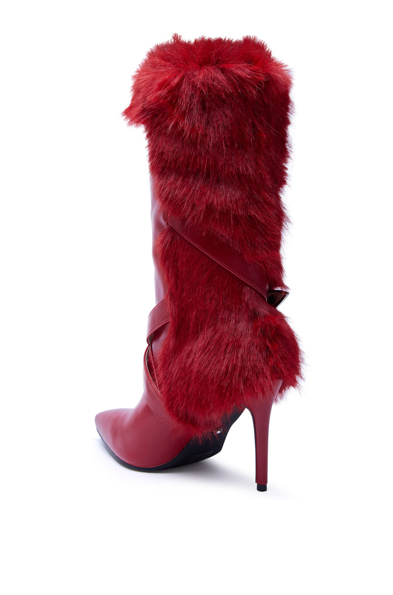 The AZALEA WANG WYLDER RED FUR BOOTIE is a striking, mid-calf stiletto boot with a pointed toe and vibrant red faux fur around the shaft, shown on a white background.