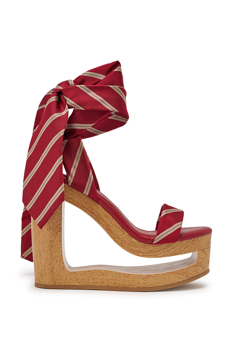 The AZALEA WANG WYNN RED TIE LACE UP WEDGE features a wooden sole with a large cutout, a red footbed, and a wide red-and-white striped ribbon ankle tie, plus a comfort cushion insole for all-day wear. 3