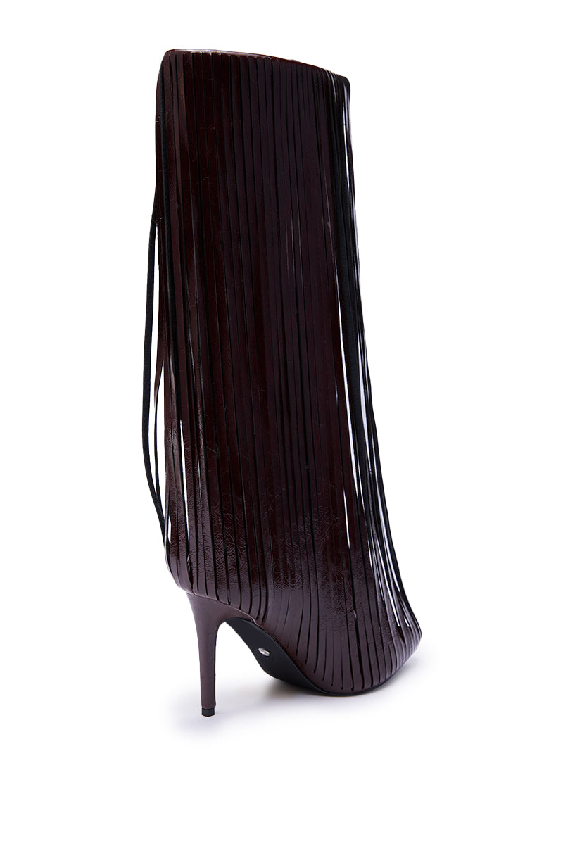 The AZALEA WANG XANTARA FRINGE BURGUNDY STILETTO BOOT features long, narrow vertical strips covering the pointed toe to heel, adding playful movement and drama to the classic knee-high silhouette. 5
