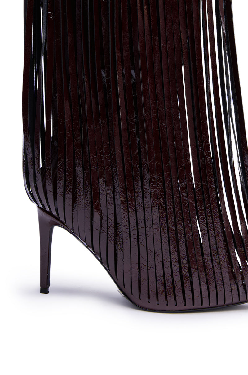 Close-up of the AZALEA WANG XANTARA FRINGE BURGUNDY STILETTO BOOT, showcasing its glossy finish and long vertical leather strips that form an elegant fringe effect. 6