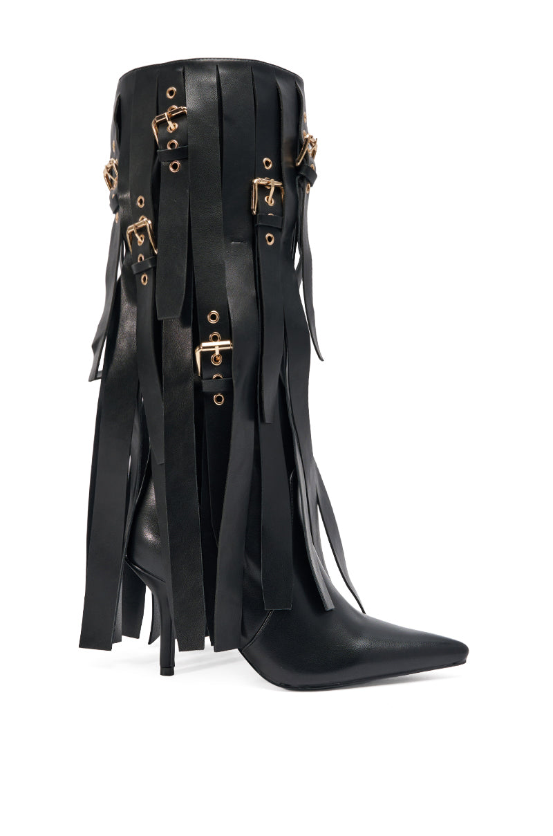 The AZALEA WANG XANTHE BLACK BELT EMBELLISHED STILETTO BOOT features a black knee-high design with a pointed toe, long leather fringe detailing, and multiple gold buckles for a bold, statement look.