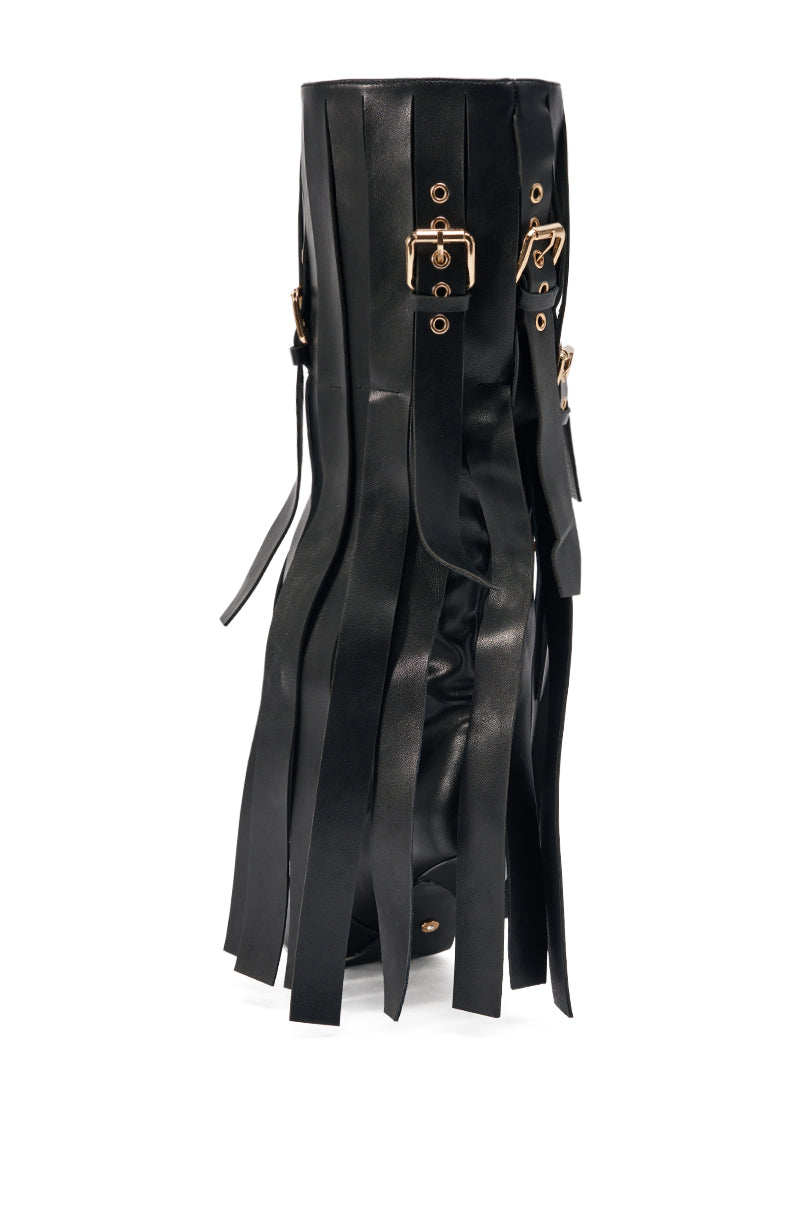 The AZALEA WANG XANTHE BLACK BELT EMBELLISHED STILETTO BOOT features a bold, modern design with black faux leather, vertical fringe strips, gold buckles, and hardware accents inspired by stiletto boot style.