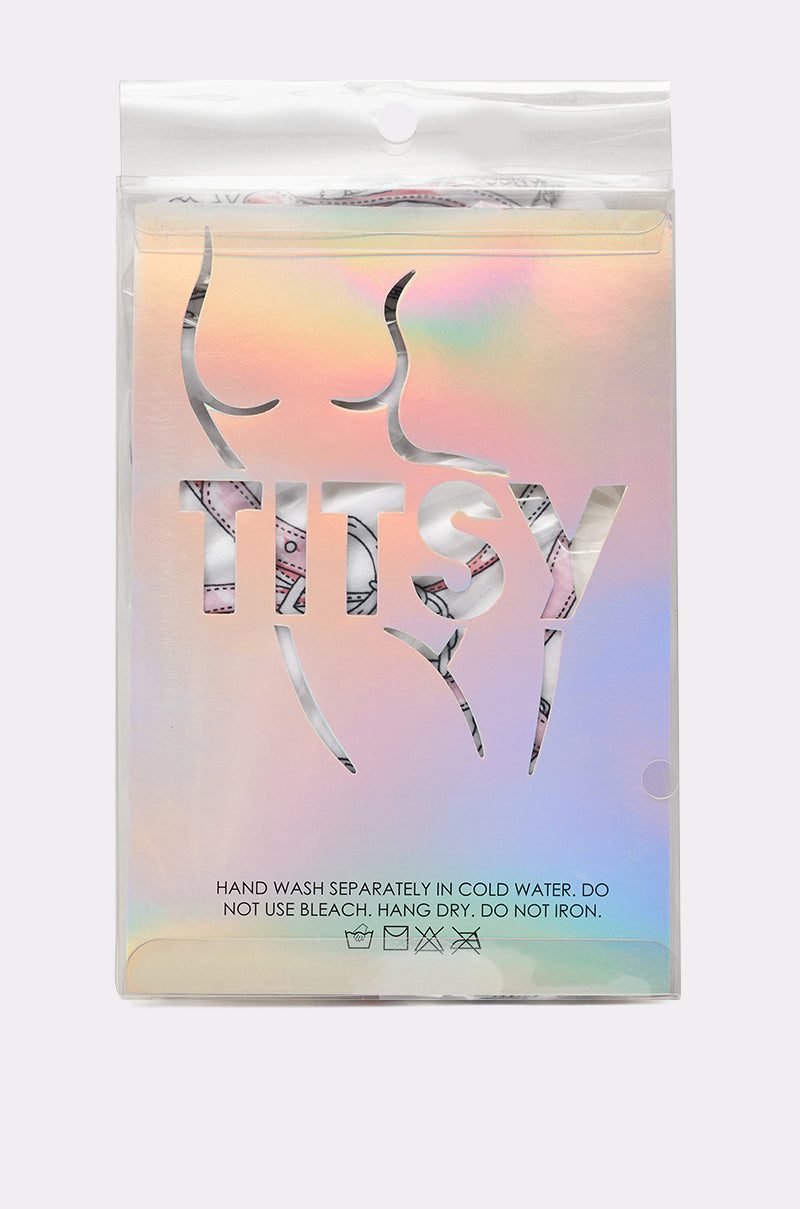 Holographic packaging with a cutout silhouette of a woman's body and "TITSY." Below, care instructions for RIDE EM TIGHTS: Hand wash separately in cold water. Do not bleach. Hang dry. Do not iron. 3