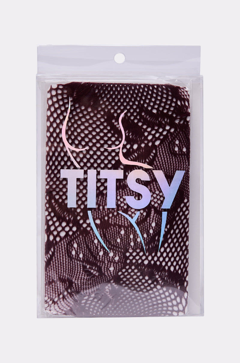 A package with a black lace pattern background, evocative of lace tights, features "REALLY WITH IT LACE TIGHTS IN BURGUNDY" in bold iridescent letters and a stylized female form blended into the design. 3