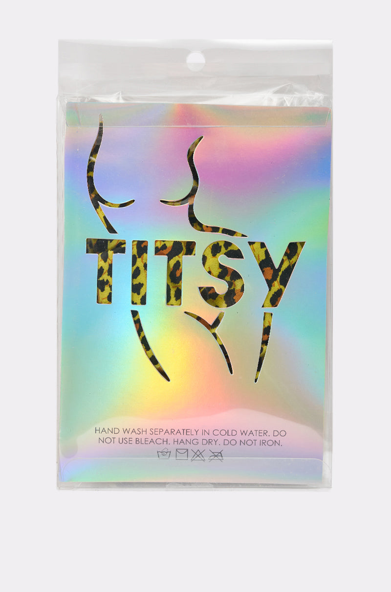 A holographic package features a female torso outline and "CHEETAH GURL TIGHTS" in leopard print—ideal for festivals or making a bold statement. Care: hand wash cold separately; do not bleach, hang dry, or iron. 5