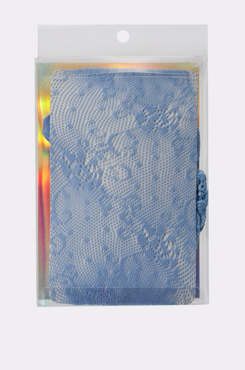 The CLASSY VIBES THIGH HIGH STOCKINGS, in a pastel blue lace design, are showcased inside a clear plastic box with a holographic background.