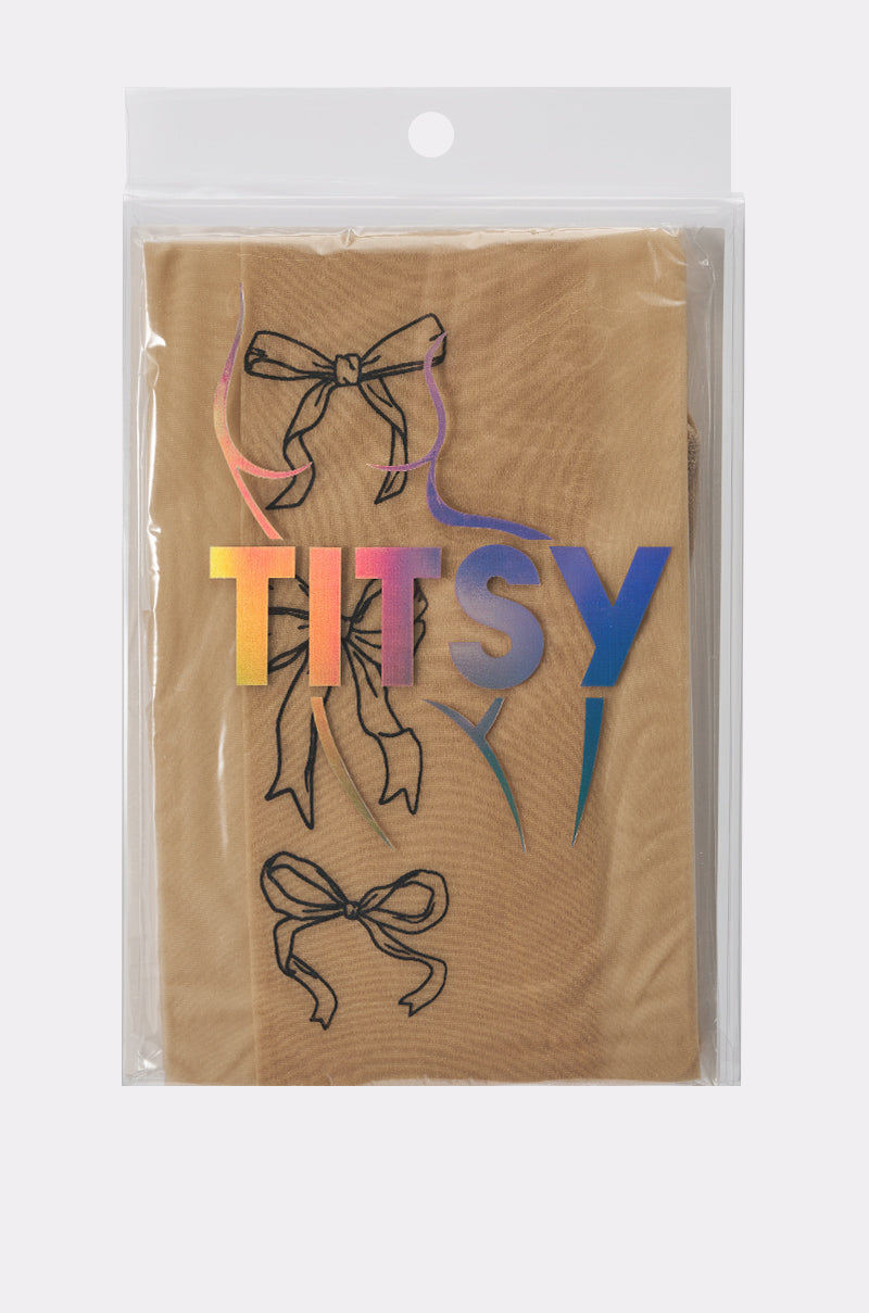 A package of WRAP WITH A BOW TIGHTS in sheer tan, featuring black bow designs and “TITSY” in bold, colorful holographic letters, displayed inside a clear plastic bag. 5