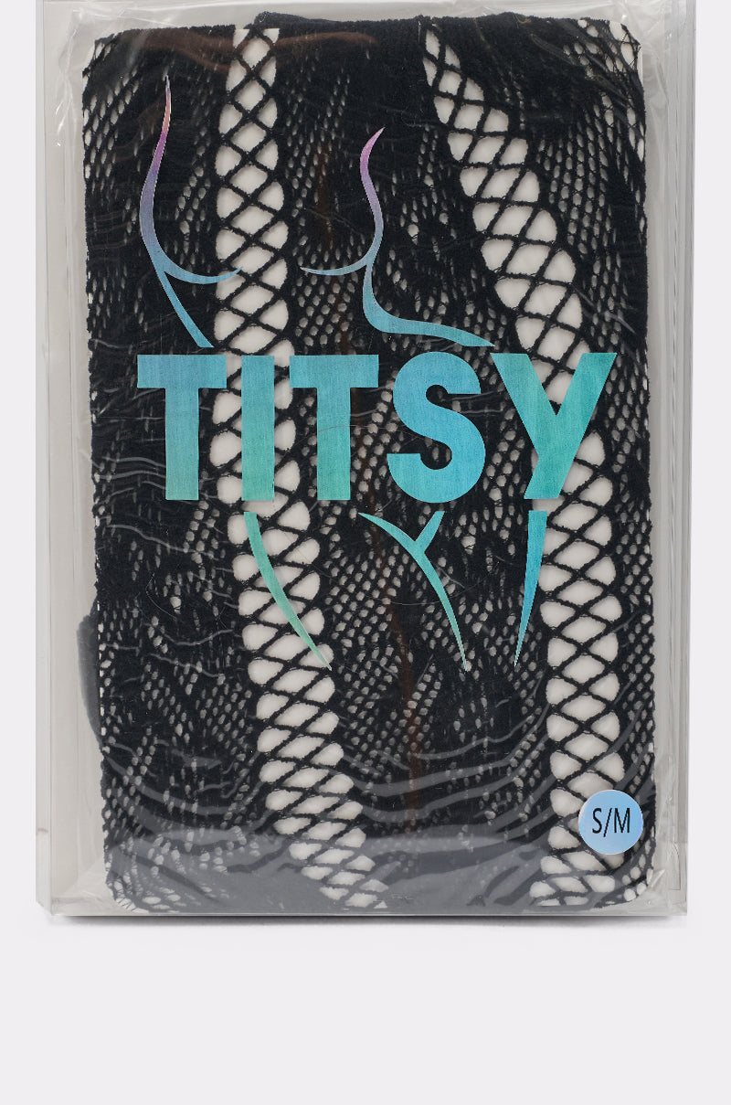 A package labeled "TITSY" in bold aqua letters contains FEMME TIGHTS IN BLACK, featuring a classic fishnet and lace pattern with an outline of a woman's body and a small "S/M" size indicator. 4