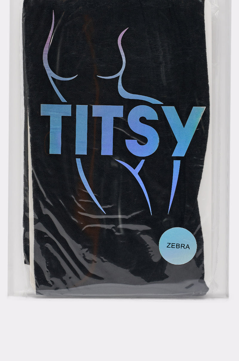 Packaged in black with "TITSY" holographic text, a body outline, and a "ZEBRA" label, ZEBRA STRIPE TIGHTS are perfect to pair with sheer zebra stripe or classic black hosiery. 2