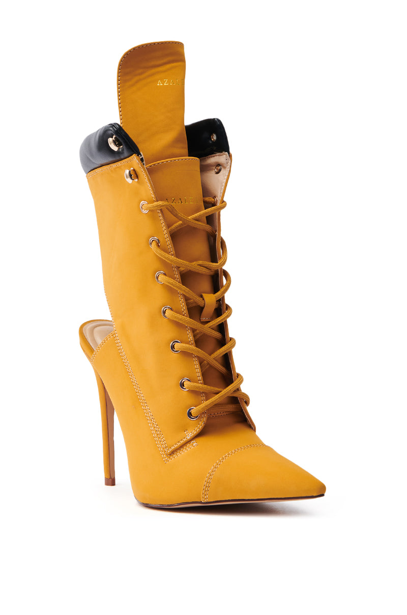 The AZALEA WANG XIOMARA YELLOW LACE UP STILETTO BOOTIE features a single pointed toe, lace-up front, black padded collar, and prominent tongue crafted from vegan leather, highlighting exquisite heel and stitching details.