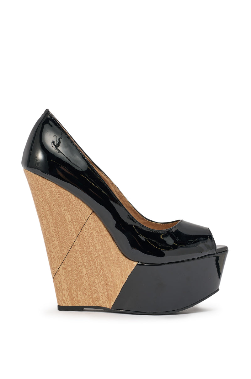The AKIRA GOLD XOE Black Wedge Open Toe Pump features faux leather, a high angular wooden platform sole, glossy black heel accents, and an elegant peep-toe design. 2