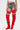 A person stands against a white background wearing a white crop top, denim shorts with red accents, and AZALEA WANG XOMARIA RED FAUX SUEDE WESTERN CHAP BOOTS featuring bold thigh-high style, pointed toes, and block heels.