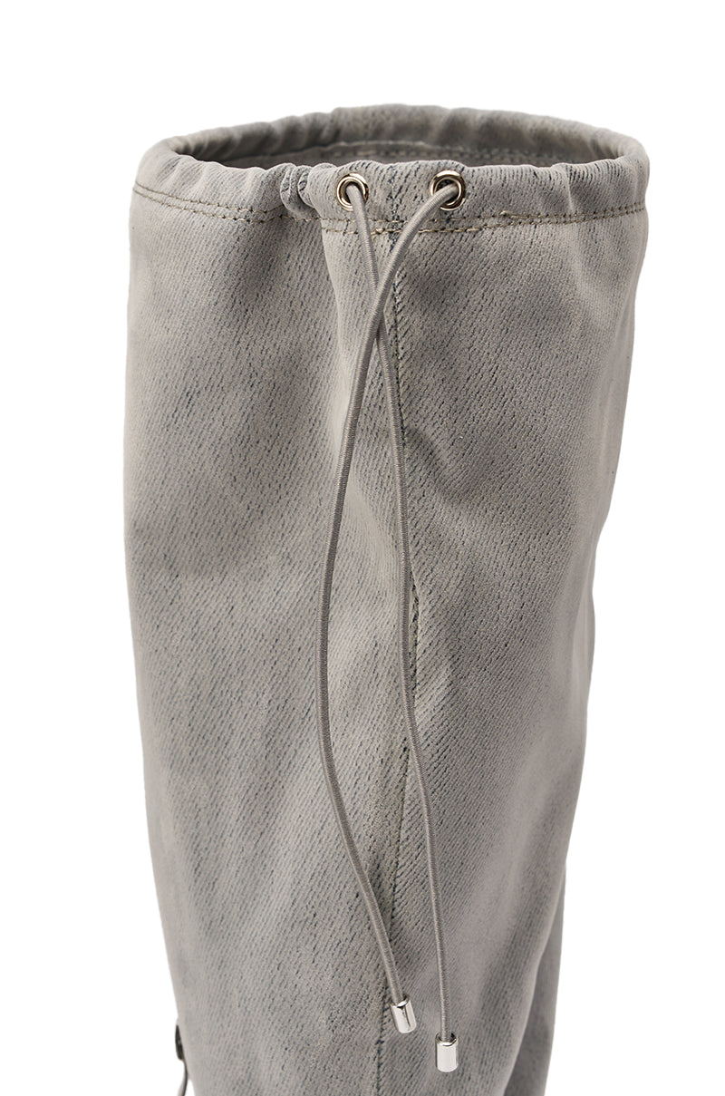 Close-up of the AZALEA WANG XYLAH GREY WEDGE GLADIATOR SANDAL’s upper: gray fabric with a drawstring closure, metal eyelets, and capped tips—elevated details that add a stylish touch to this knee-high sandal boot. 9