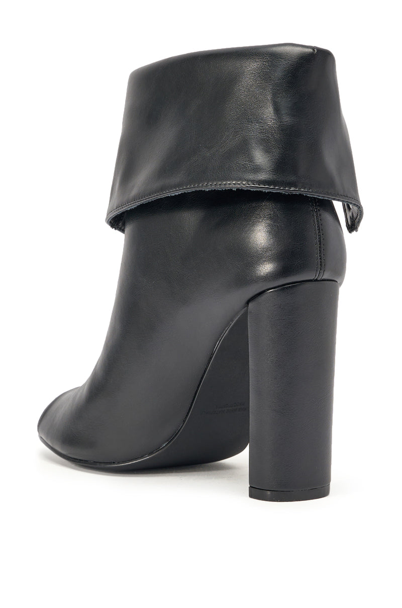 The YANIX BLACK PU SILVER HARDWARE CHUNKY HEEL BOOTIE features a black faux leather ankle-high design, chunky block heel, and folded cuff at the top, shown from the back and slightly angled. 5
