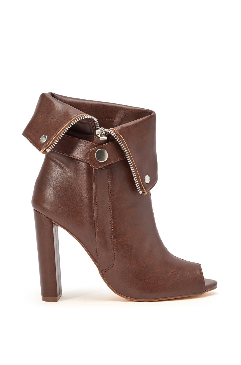 The YANIX BROWN PU SILVER HARDWARE CHUNKY HEEL BOOTIE features a folded cuff, exposed silver zipper, snap button accents, peep toe, and block heel, displayed on a white background. 3