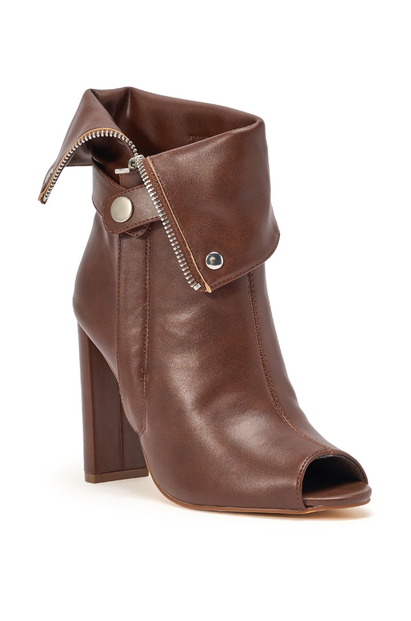 The YANIX BROWN PU SILVER HARDWARE CHUNKY HEEL BOOTIE features a peep toe, folded cuff, decorative zipper, silver snaps, smooth PU finish, and a chunky heel for height and comfort. 4