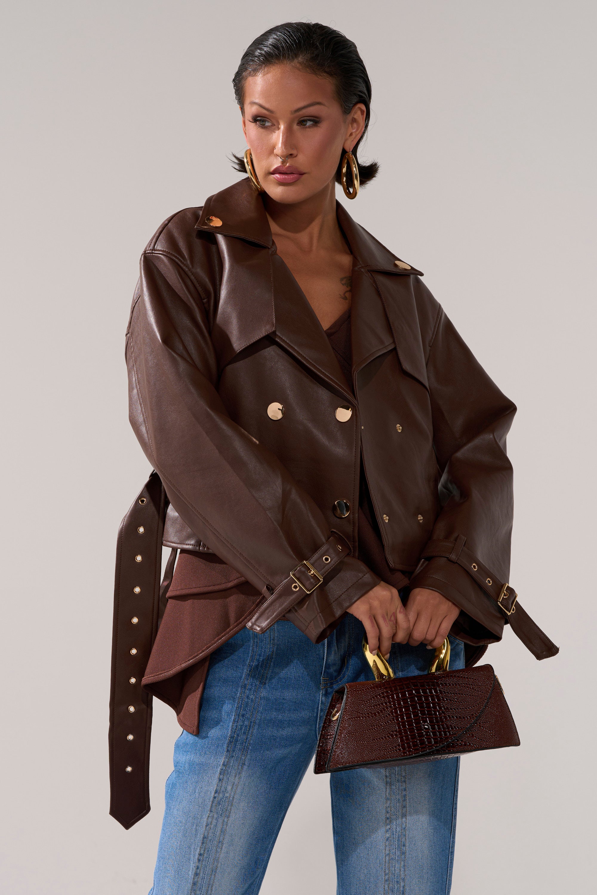 A woman in the stylish LINA TRENCH MOTO coat.