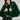 A person wearing the LUCKY HOODED FUR BOMBER in a vibrant green hue over a sheer black top with textured patterns stands against a plain background. They have long dark hair and wear large, dangling earrings.