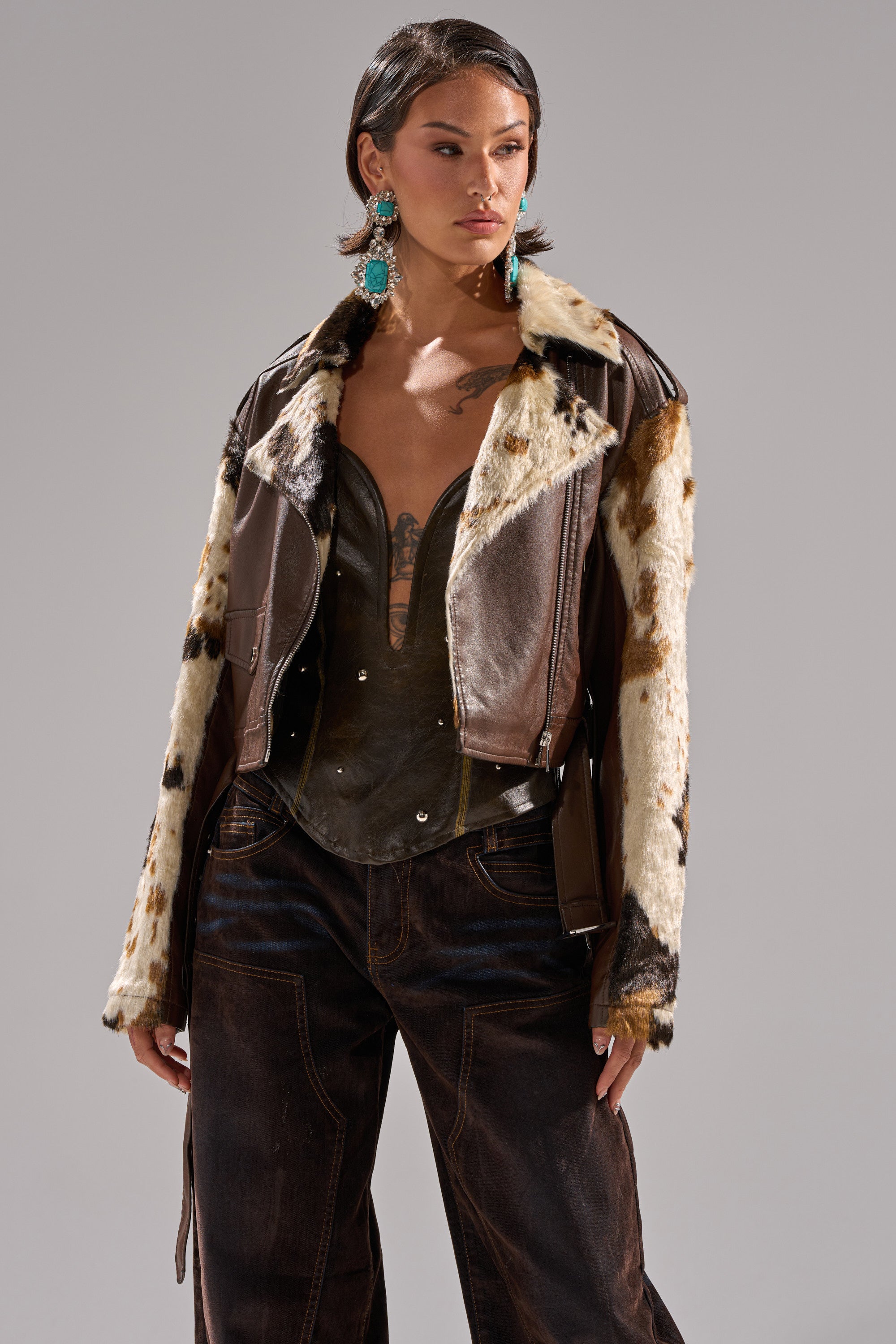 A person posing for the camera in the OUT WEST CROPPED MOTO jacket. 2