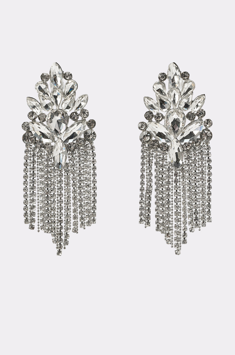 The GNO EARRING features ornate silver rhinestone clusters with clear stones and cascading crystal strands, creating a sparkling chandelier effect—ideal for wedding guests. 0