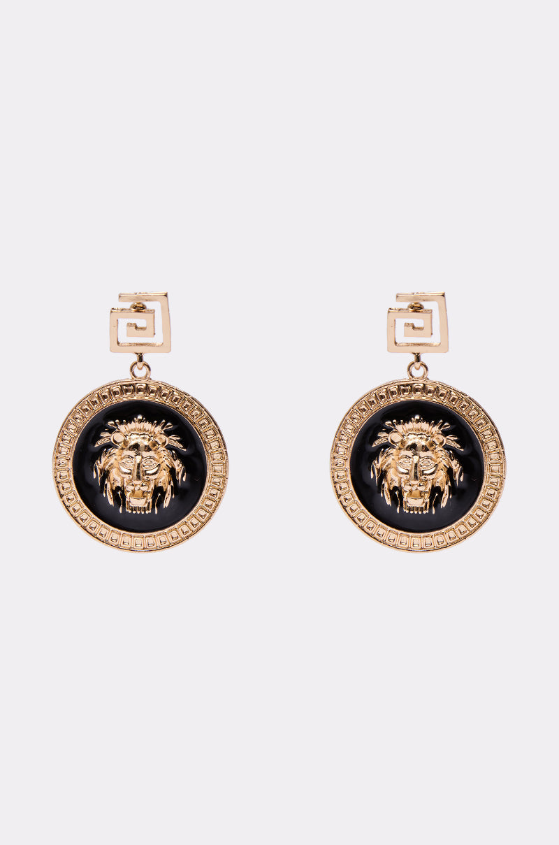 Make a bold statement with the LION'S SHARE EARRING, showcasing a gold round pendant with a raised lion head and classic Greek key pattern, suspended from geometric square studs for an elegant look. 0