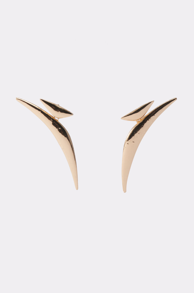 The DONT PLAY EARRING is a modern pair of gold metallic earrings with sculptural, curved, pointed shapes, shown against a light grey background—ideal for elevating minimalist outfits. 1