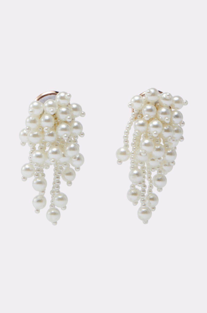 The REGAL PEARL DROP EARRING features cascading faux pearls arranged in grape-like clusters, ideal for bridal looks and showcased on a simple light background. 0