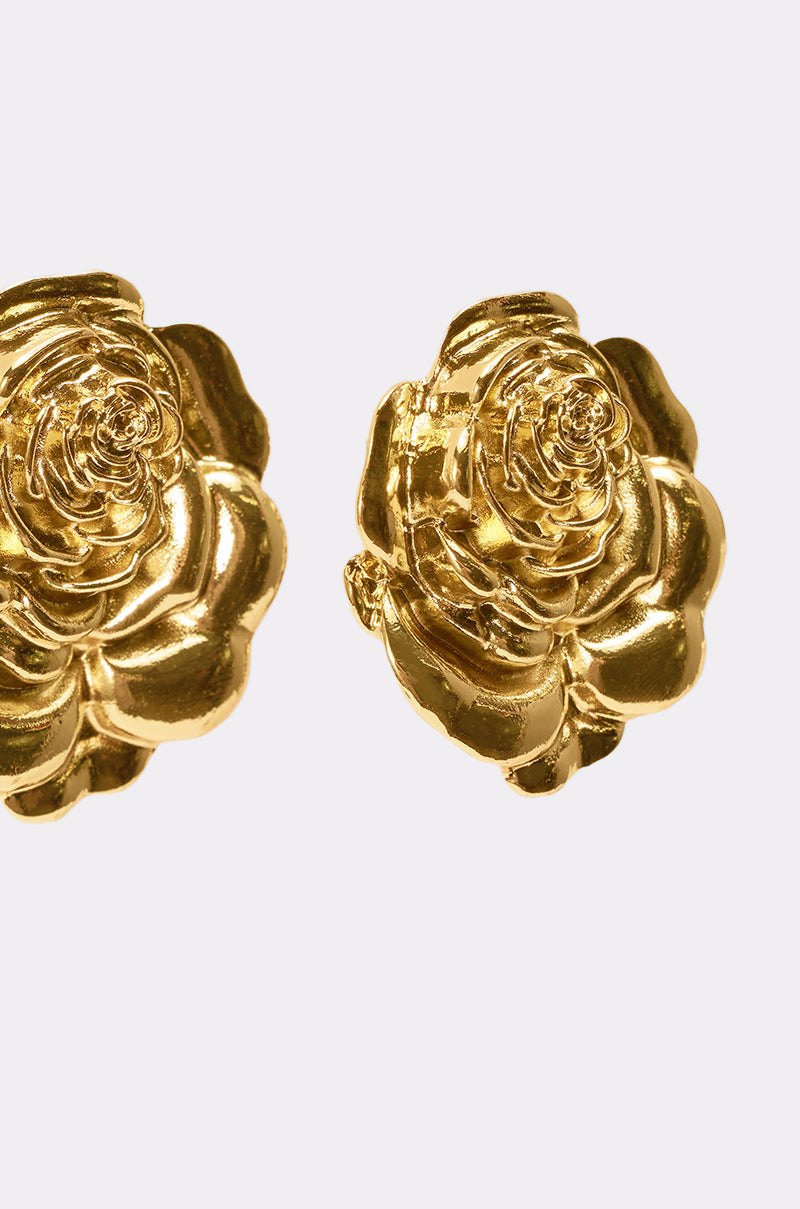 The IN BLOOM EARRING features shiny gold earrings shaped like blooming roses, displayed against a light background—ideal for floral jewelry lovers. 5