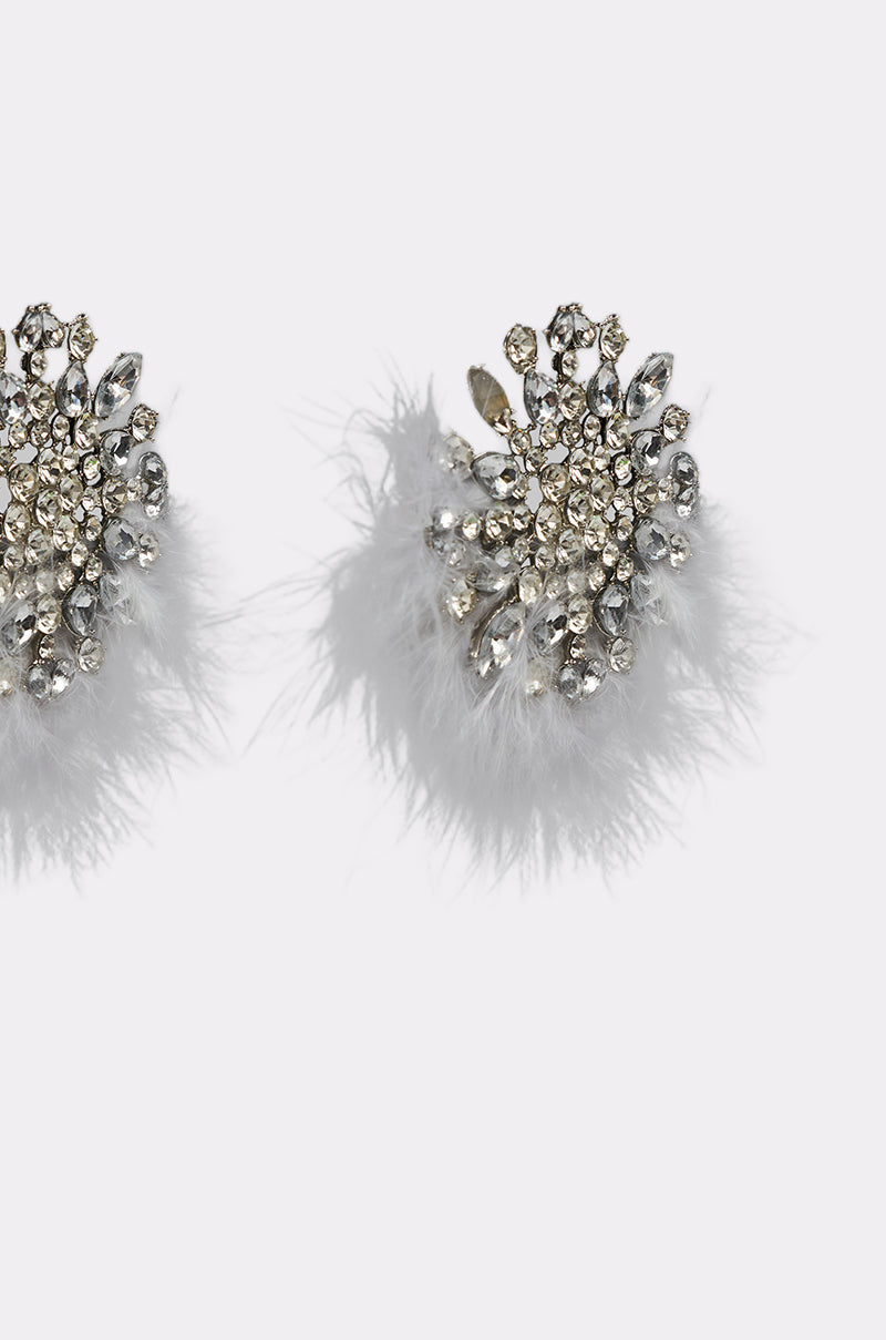 The LIFE OF THE PARTY EARRING features clusters of sparkling rhinestones in a floral pattern with fluffy white feathers at the base, beautifully set against a plain white background. 4
