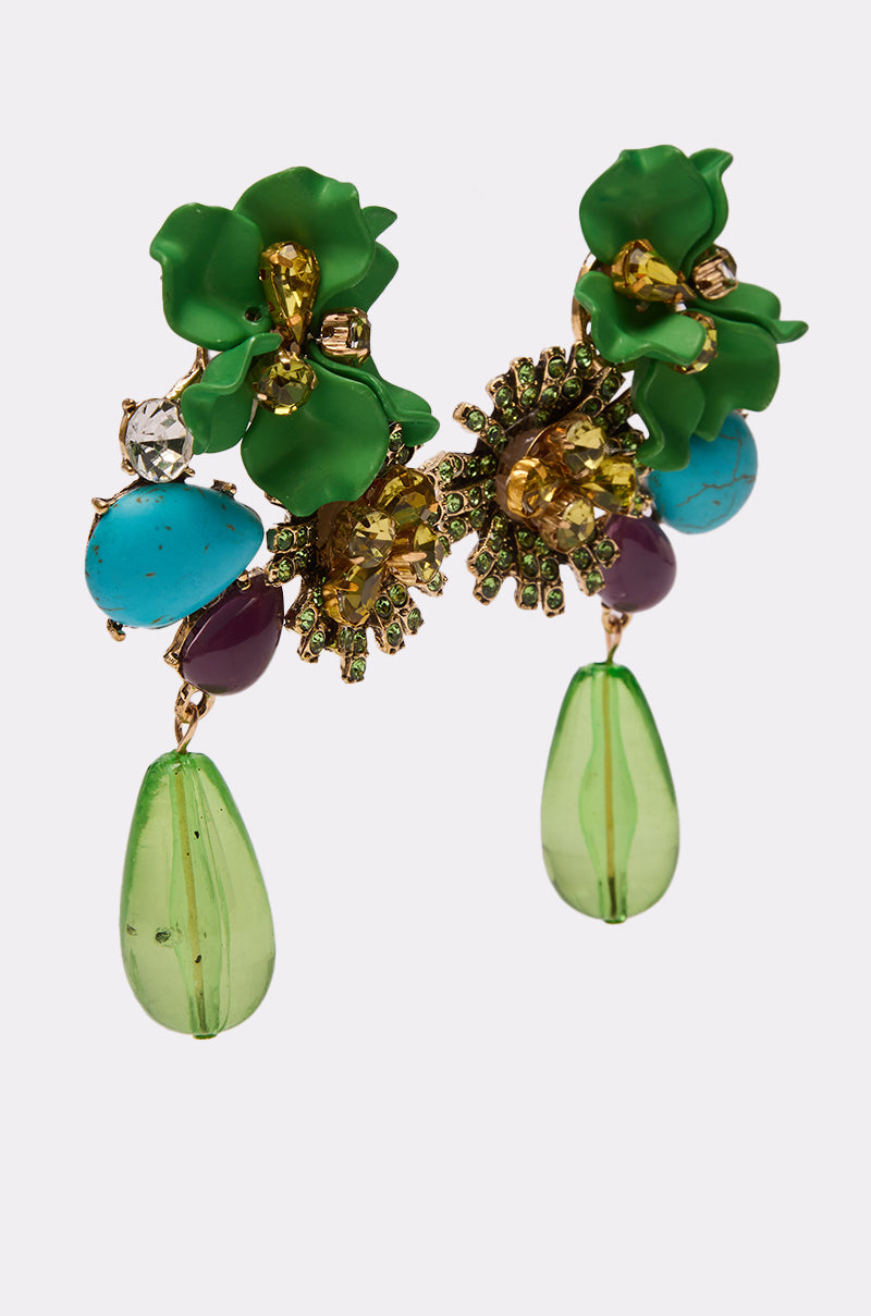 The GREEN GLORY EARRING features green floral shapes, yellow and purple gemstones, turquoise beads, and translucent green teardrop dangles for a bold statement look. 2