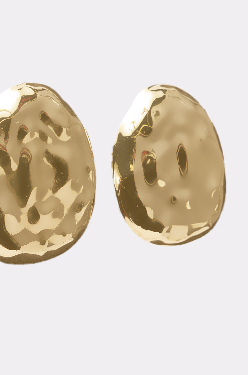 Two shiny BENT OUTTA SHAPE EARRINGs from AKIRA Label, featuring irregular hammered gold shapes and a textured surface, are displayed against a plain light gray background. 4