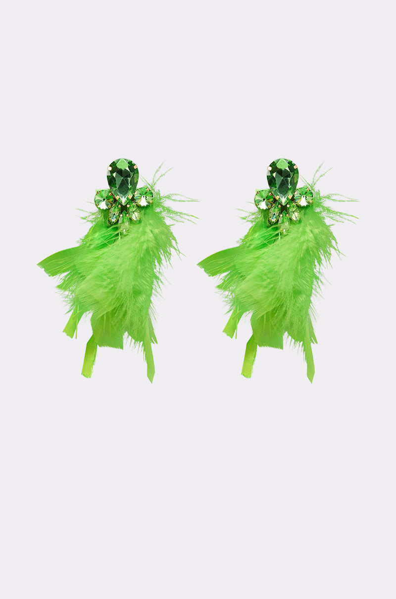 The SHOW IT OFF EARRING features vibrant emerald-green neon feathers and sparkling gemstones, designed to stand out against a plain white background. 2