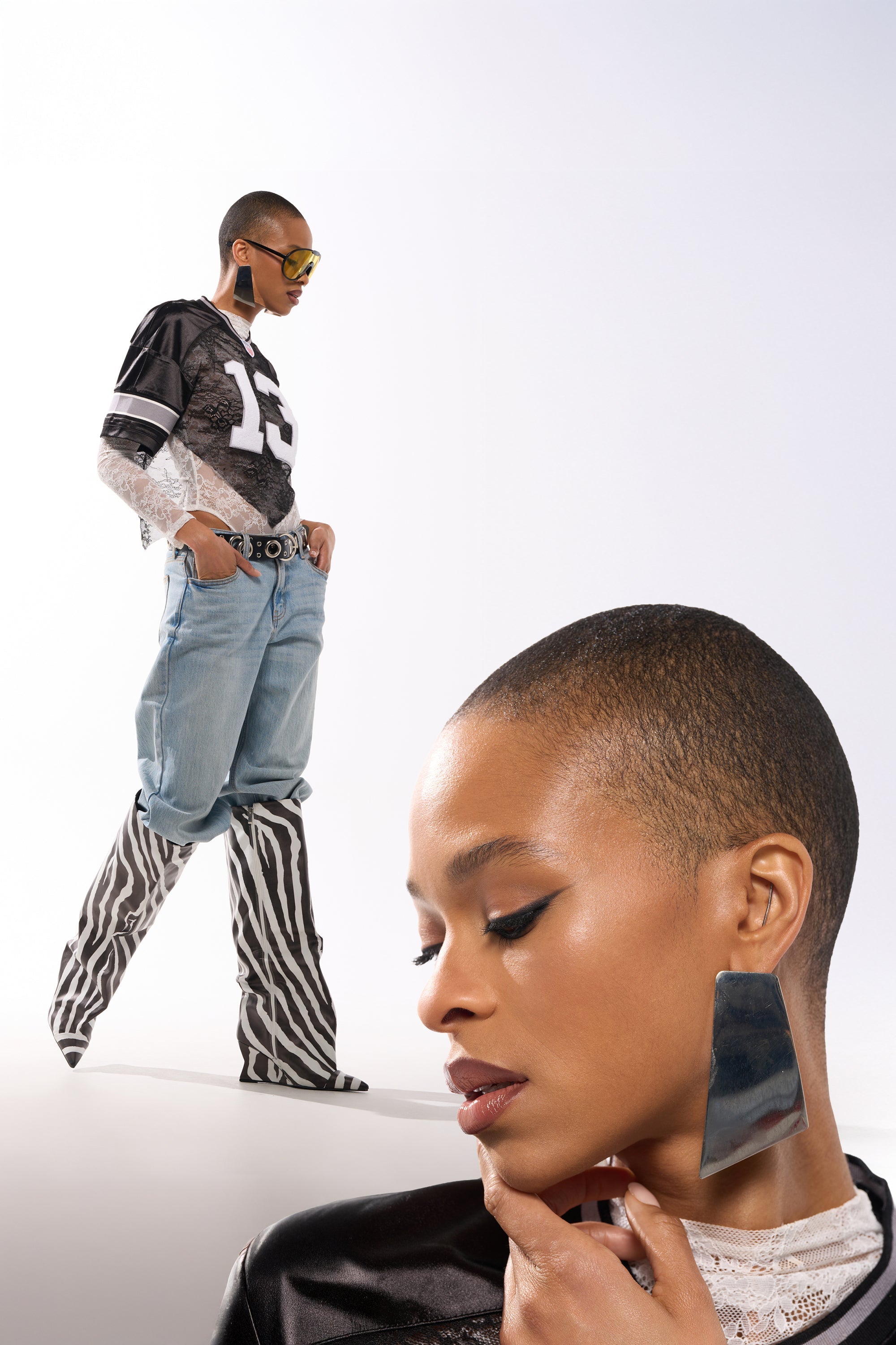A stylish person in oversized jeans, a black jersey, and zebra-print boots poses confidently with bold makeup and a close-up below highlighting the ON YOUR FEED EARRING against a white background. 1