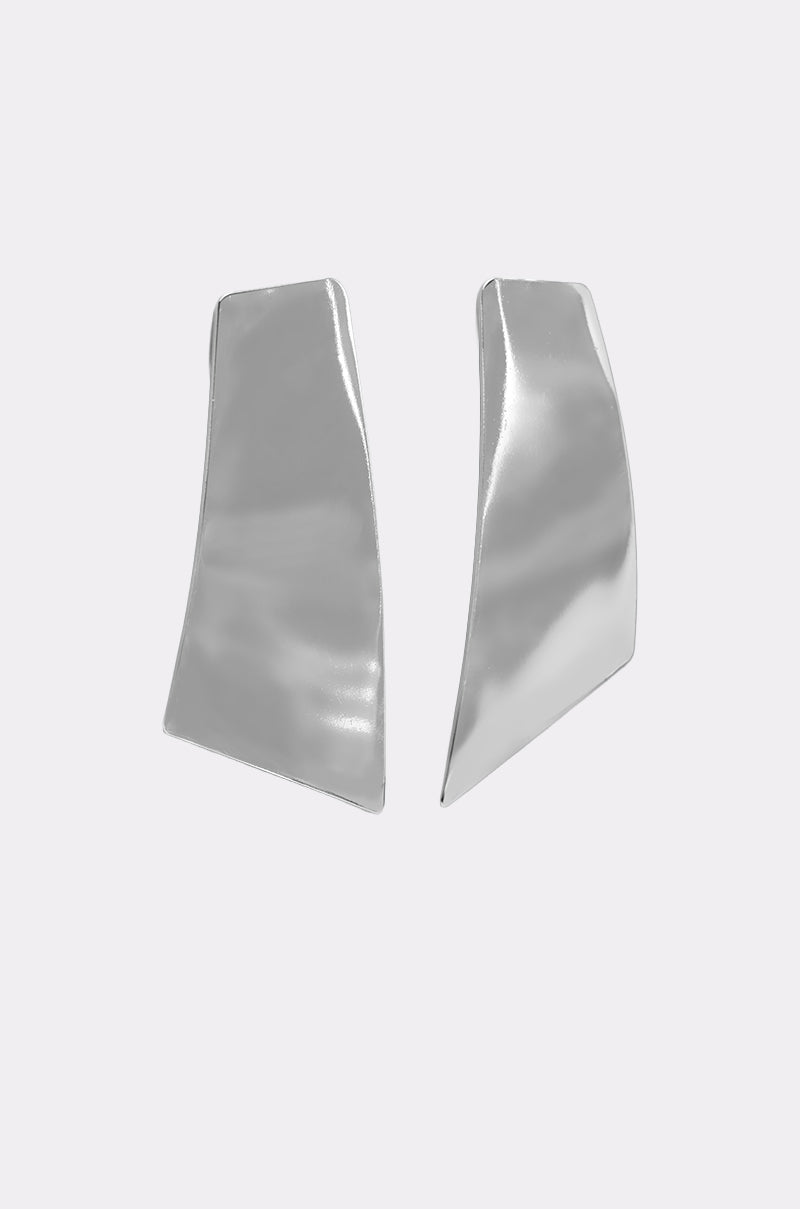 The ON YOUR FEED EARRING set features modern, asymmetrical silver-tone earrings with a smooth, reflective finish, showcased on a light gray background. 2