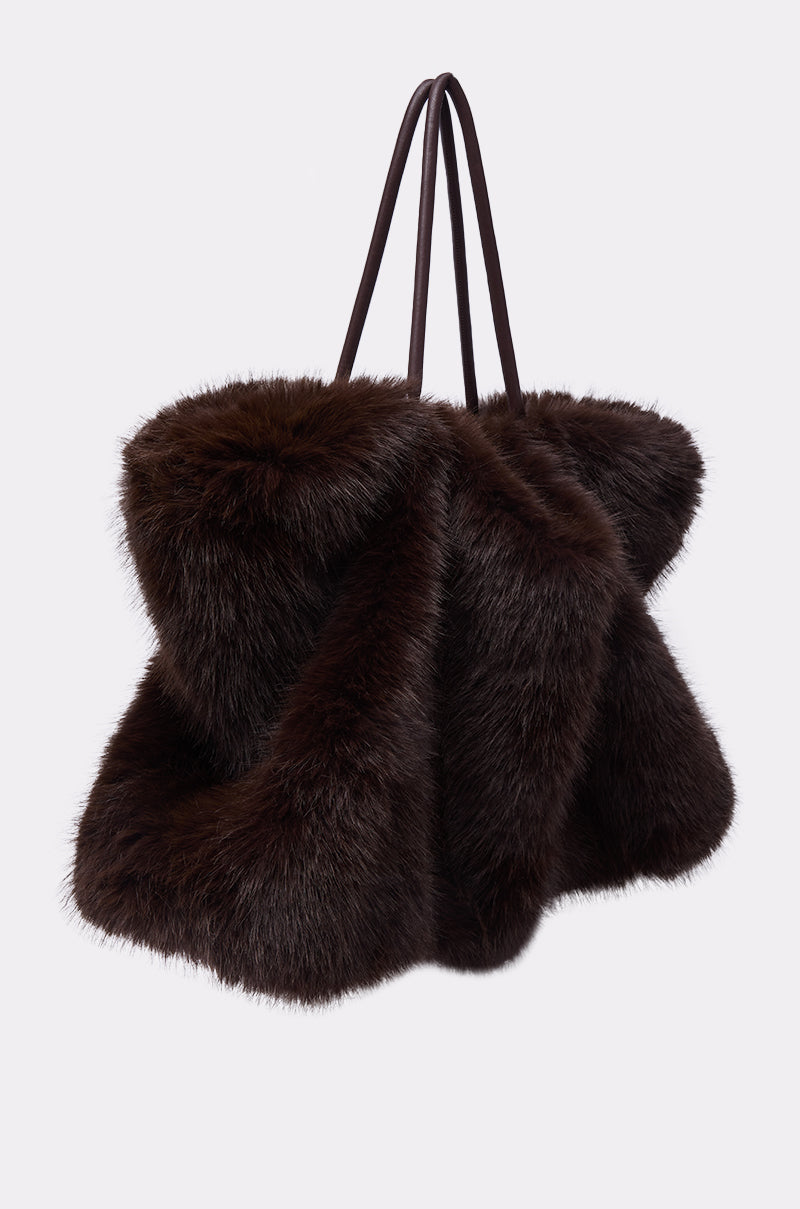 The SO RICH FAUX FUR TOTE is a large, fluffy dark brown bag with two thin black handles, shown against a plain white background. 2
