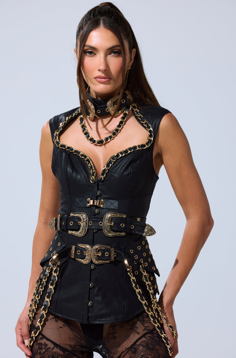 Woman wearing the LETS GO TO THE RODEO BLOUSE, styled with layered necklaces and lace tights, standing confidently against a plain light background. 3