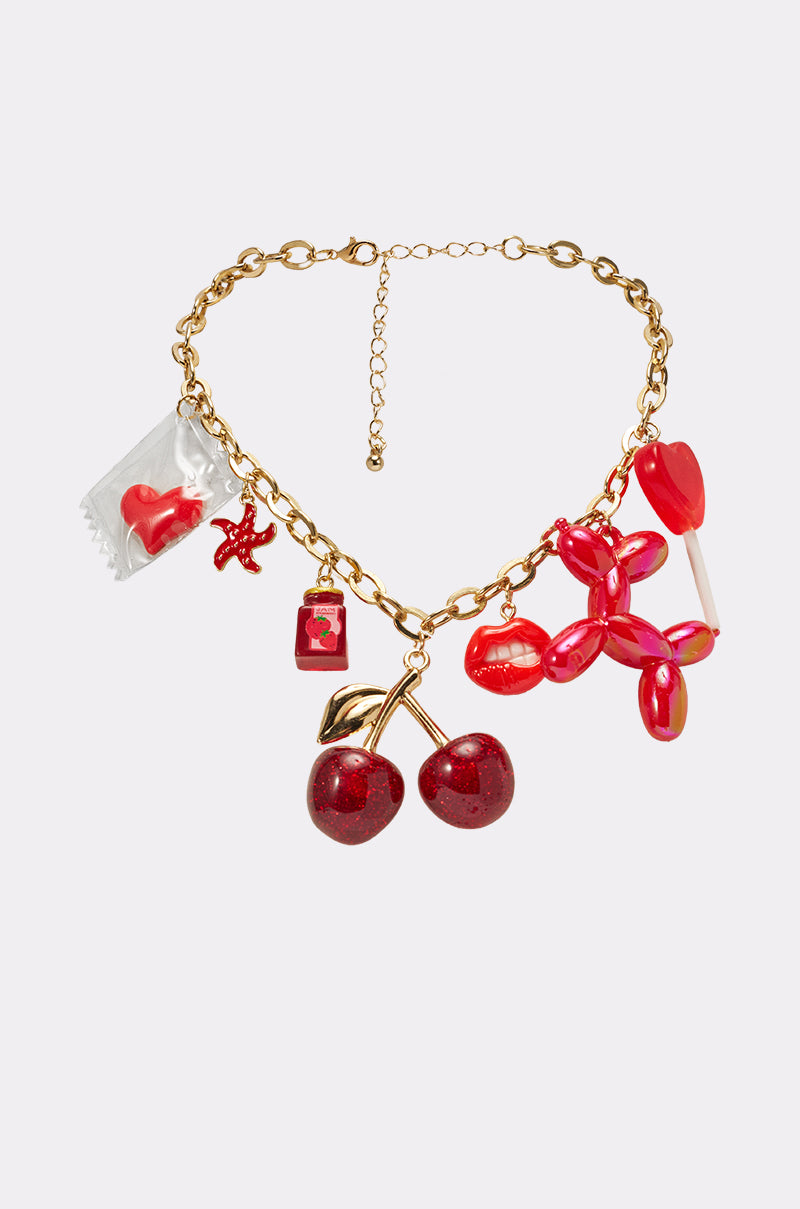 The HAVE SOME FUN NECKLACE is a chunky gold chain featuring playful red accents—cherries, a balloon dog, lipstick, wrapped candy, a starfish, and a rectangular pendant—for the ultimate Y2K vibe. 0