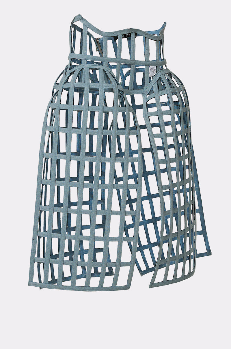 The NEVER CAGED BELT features a blue, cage-like hoop skirt design with intersecting bands, recalling historical crinolines or panniers and reimagined for bold statement layering. Shown against a plain white background. 9