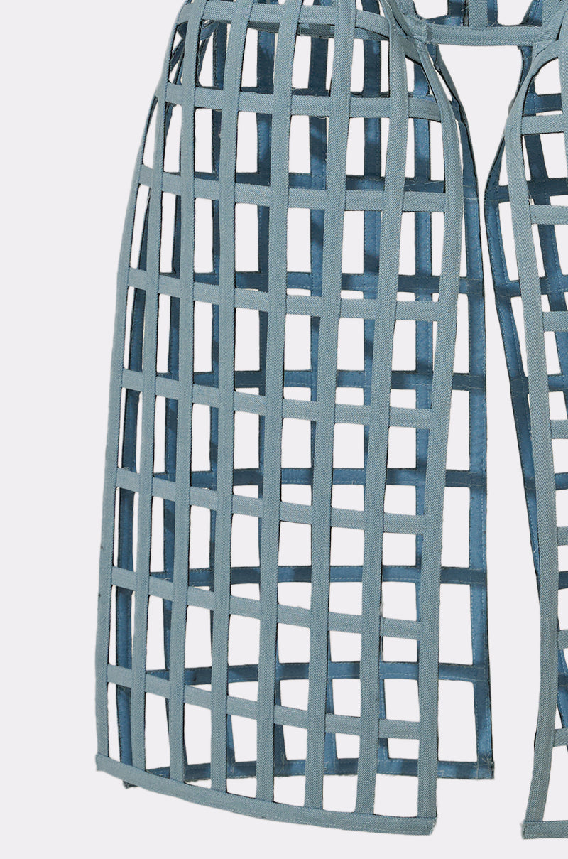 The NEVER CAGED BELT features blue fabric strips in a grid pattern, creating an open, cage-like structure with rectangular gaps—ideal for statement layering or accentuating outfits with its architectural look. 10